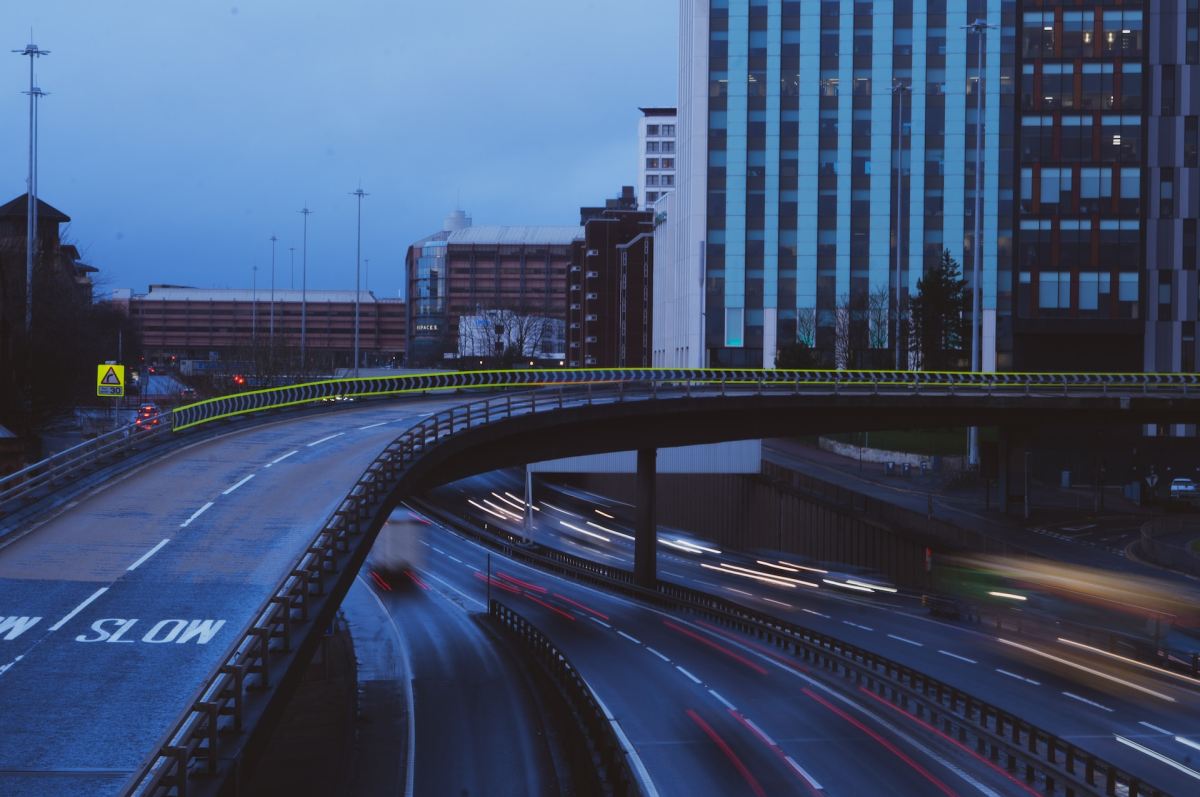 Slow road bridges over fast highway.
